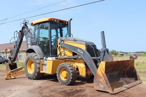 Fleet of yellow and black construction vehicles on site
